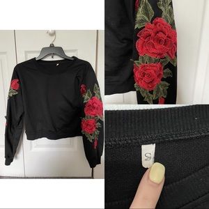Black sweater with rose detailing